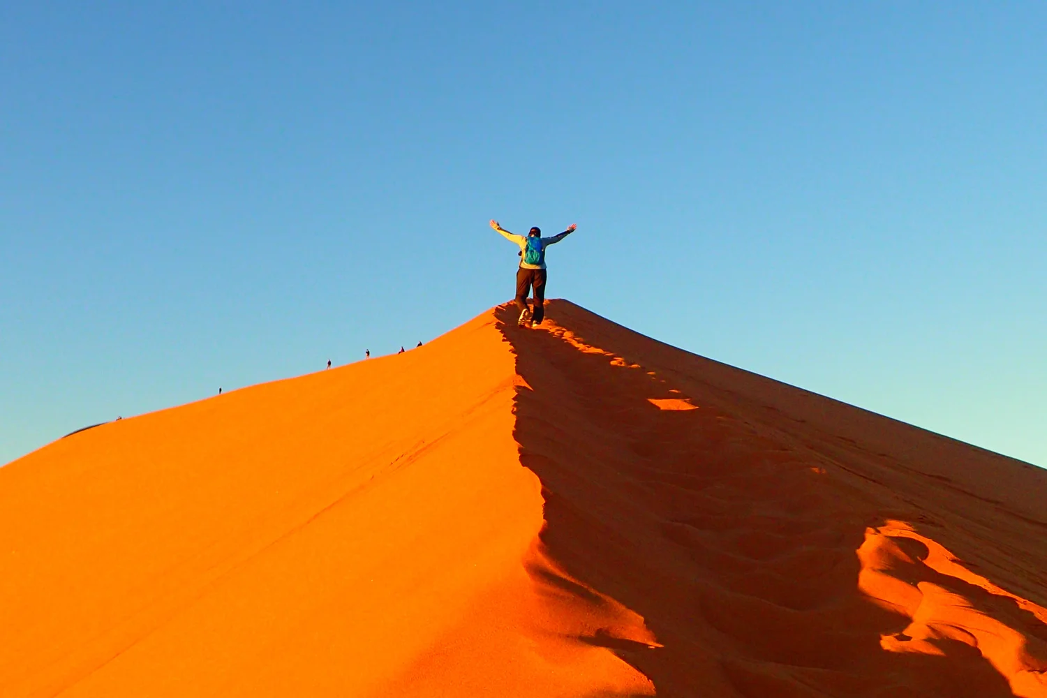 Climbers on Dune 45 in the Namib Desert