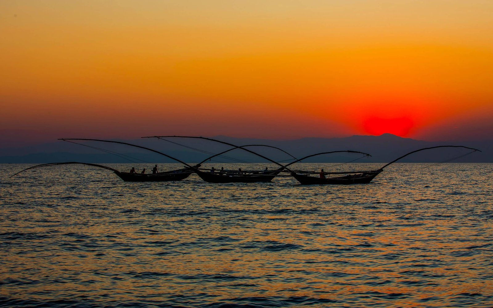 Fishermen on Lake Kivu at sunset