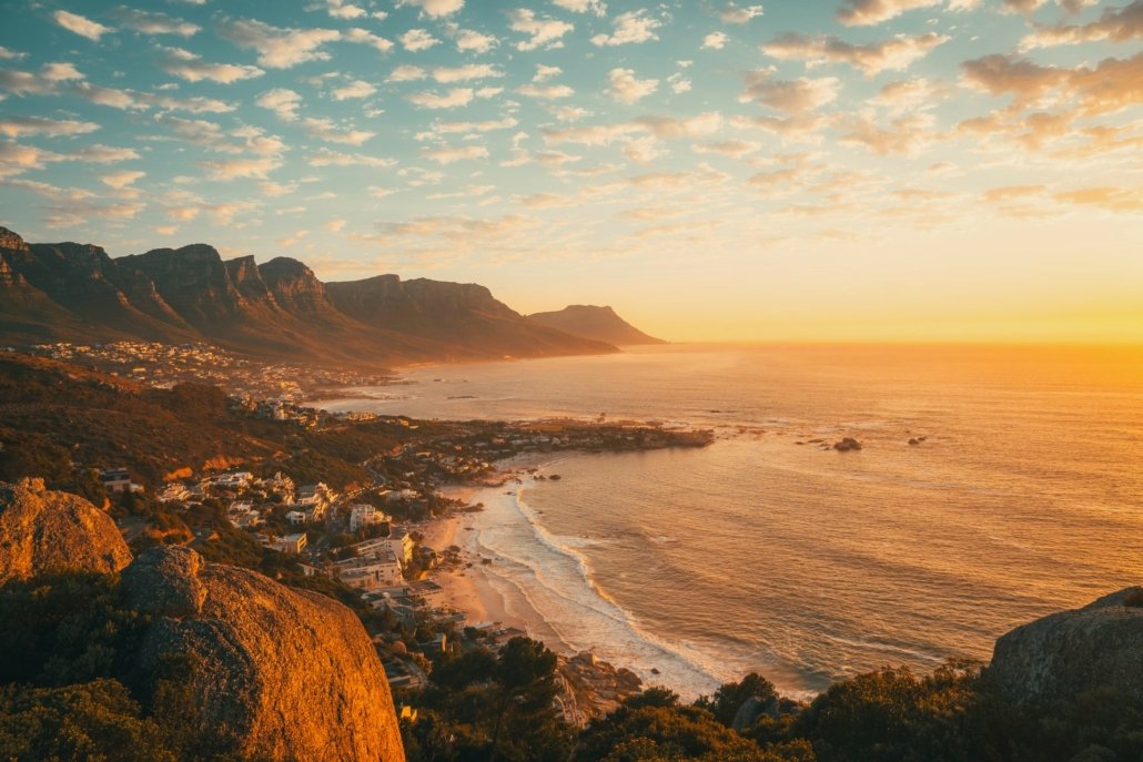 Sunrise over Camps Bay beach below the Twelve Apostles mountains, Cape Town