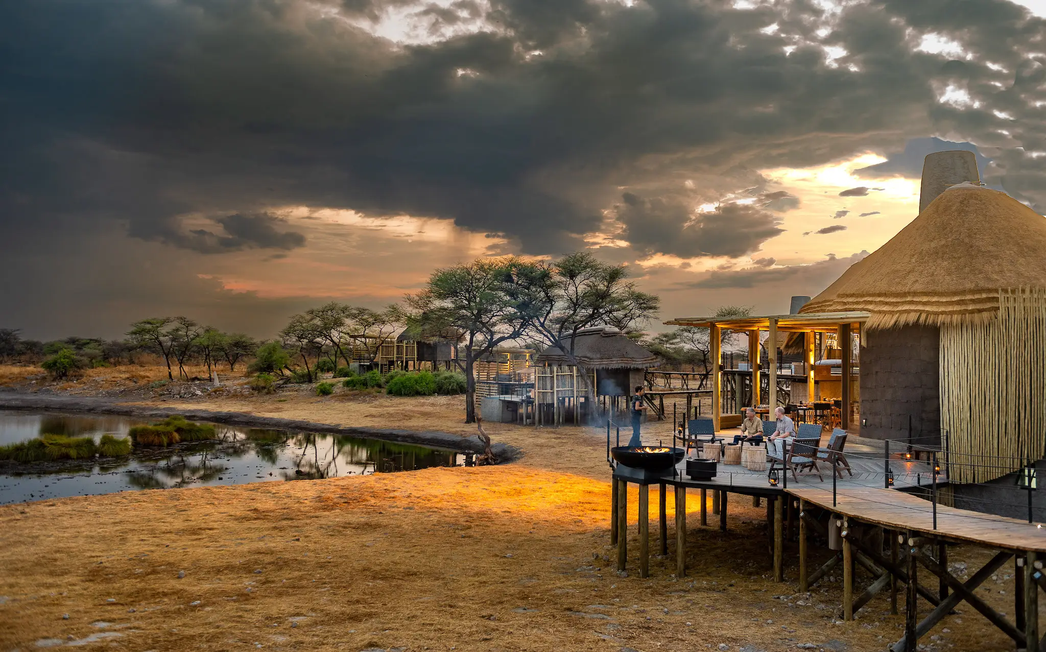 Onguma Tented Camp beside a waterhole on Onguma Private Game Reserve, Namibia